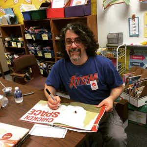 Signing books after the author visit
